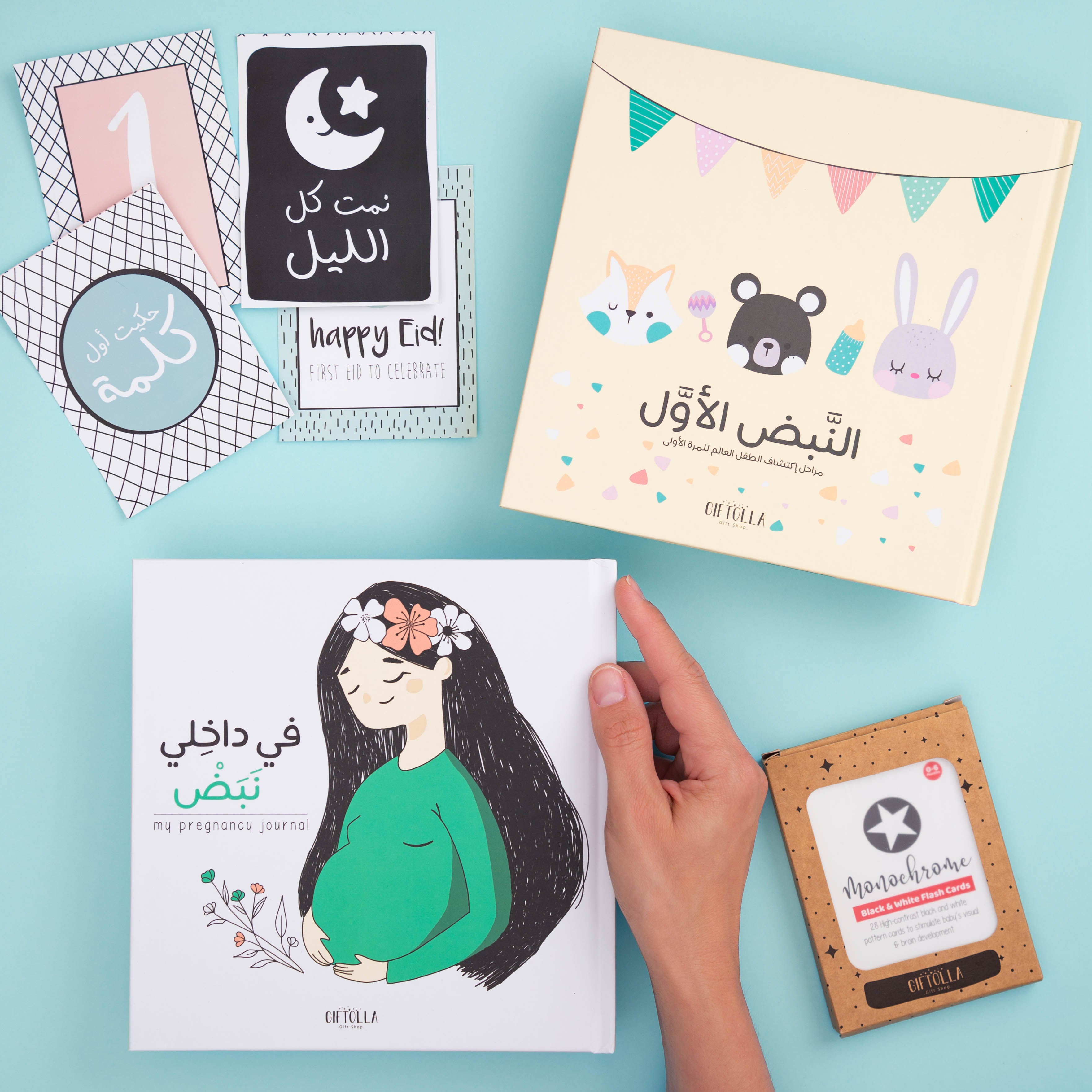 2 baby milestone books with mile stone cards and motessori cards