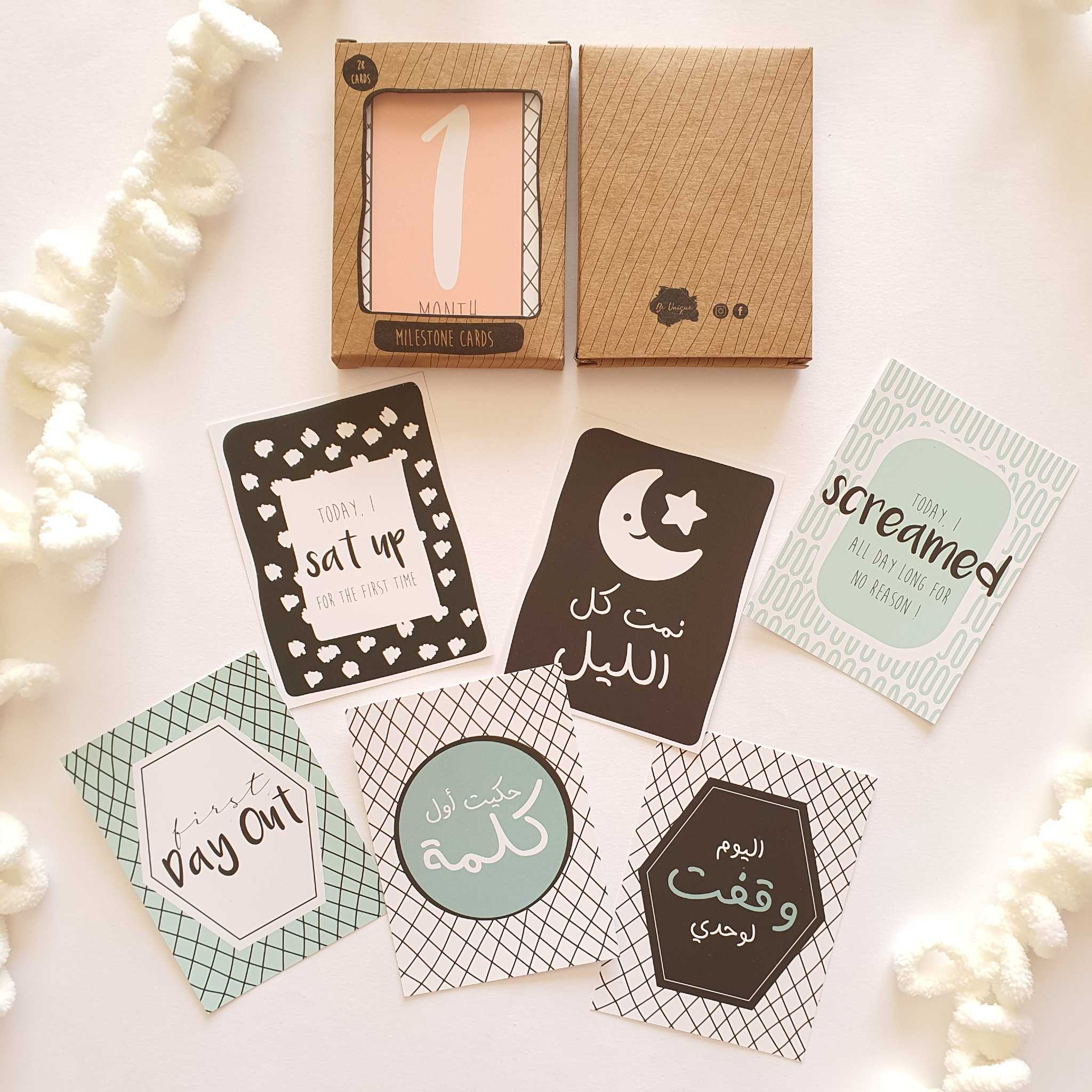 6 Giftolla baby milestone cards with their package above them. Written on one of them "Today I sat up for the first time"